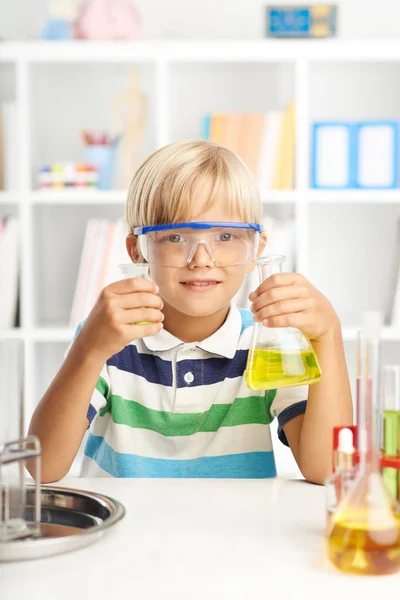 Little scientist with two flasks — Stock Photo, Image