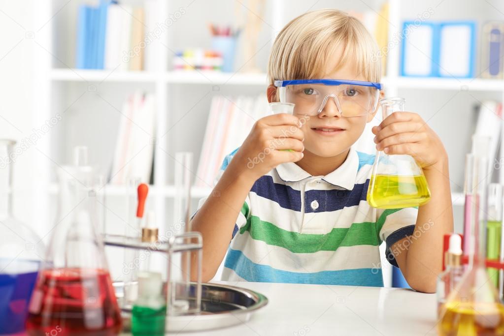 Boy working with chemical reagents