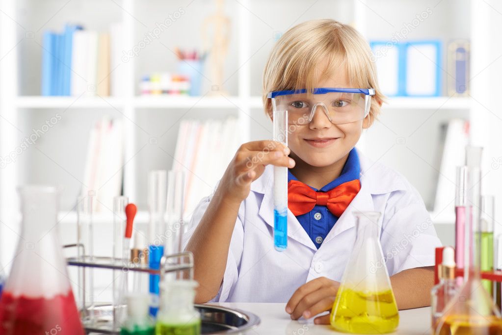 Little boy working in laboratory
