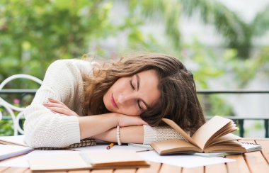 woman fell asleep when doing homework clipart