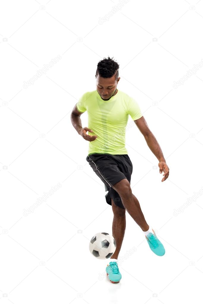 soccer player dribbling a ball