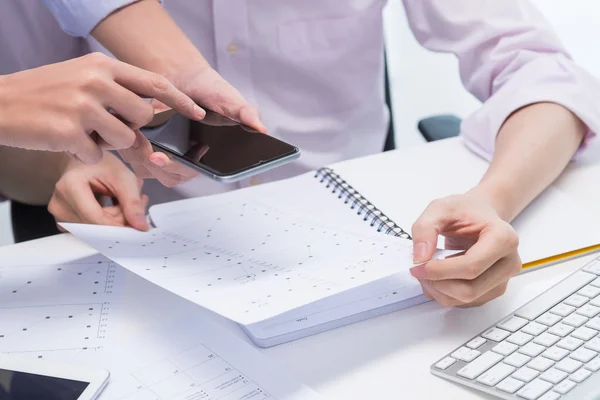 People taking photo of financial report — Stock Photo, Image