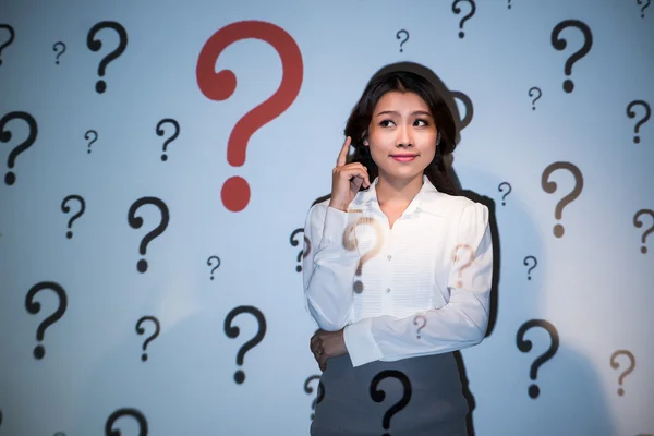 Business woman having many questions — Stock Photo, Image