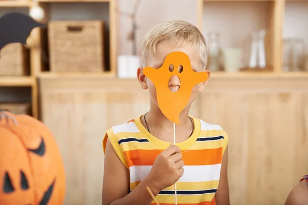 Funny boy with paper ghost — Stock Photo, Image