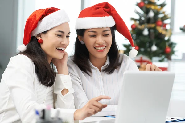 Asian female colleagues shopping online — Stock Photo, Image