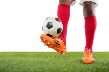 Soccer player kicking ball clipart