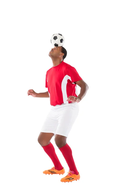 Soccer player heading ball — Stock Photo, Image