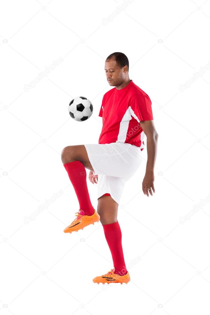 Soccer player juggling ball