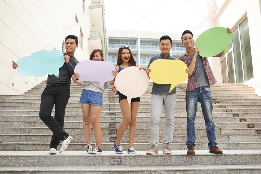 Teenagers posing with talk clouds