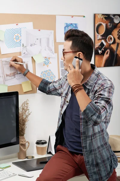 Interior designer talking on phone