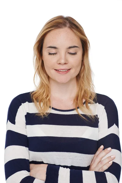 Smiling girl keeping her eyes closed — Stock Photo, Image