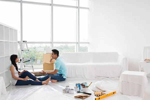 Asian couple making repairs in apartment — Stock Image Asian couple making repairs in apartment Stock Image
