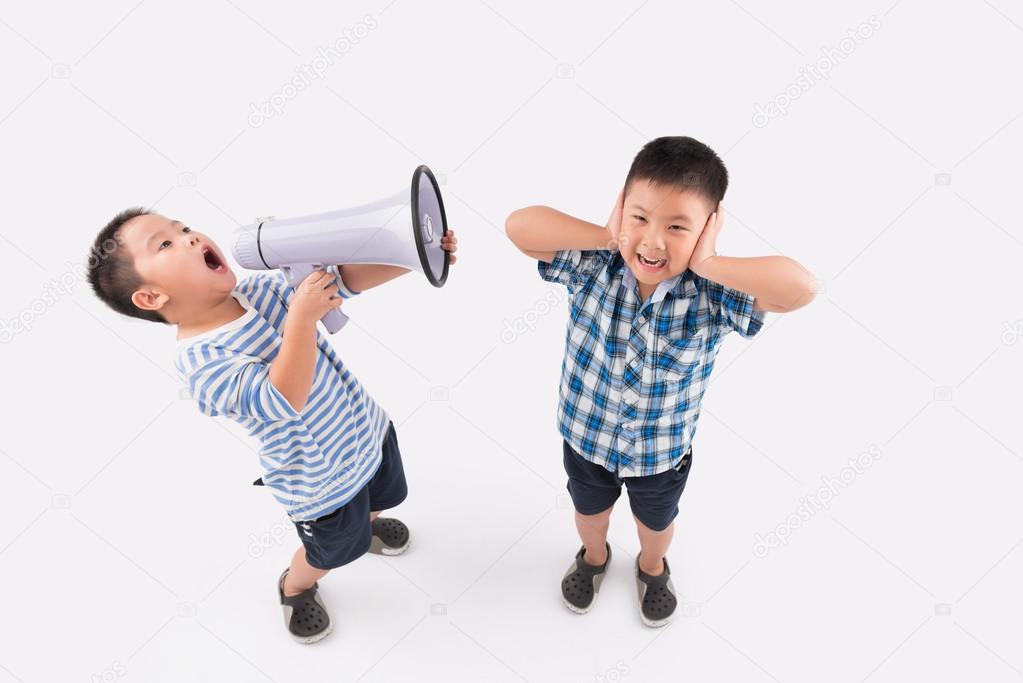 Little boy shouting into megaphone