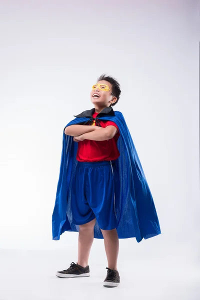 Brave confident boy in superhero costume — Stock Photo, Image