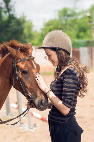 Girl with bay horse — Stock Photo, Image