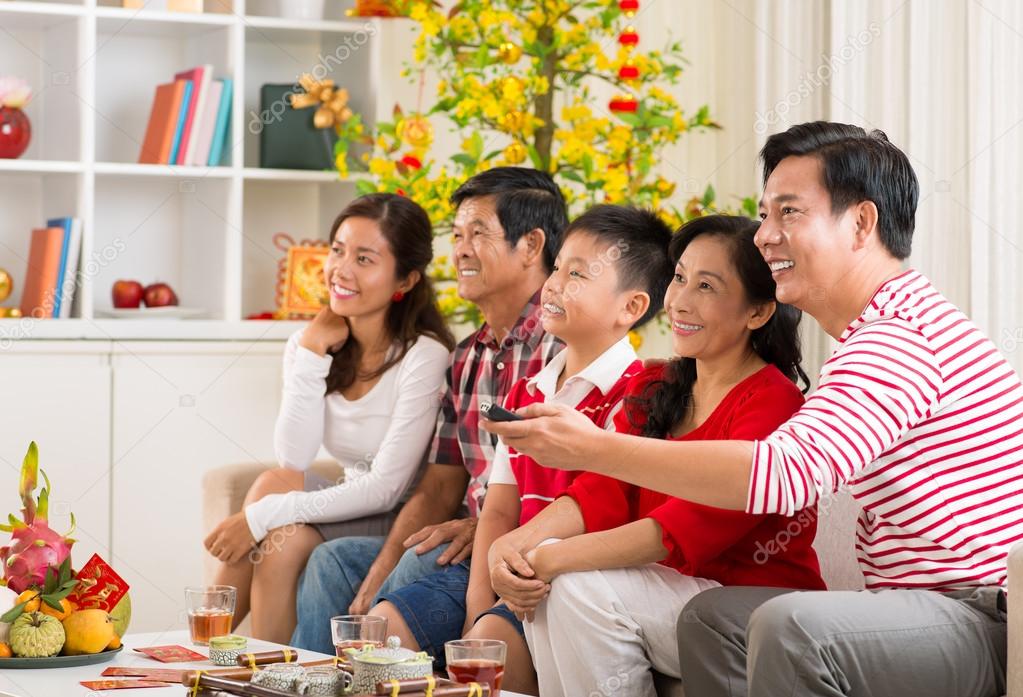 Vietnamese family watching tv