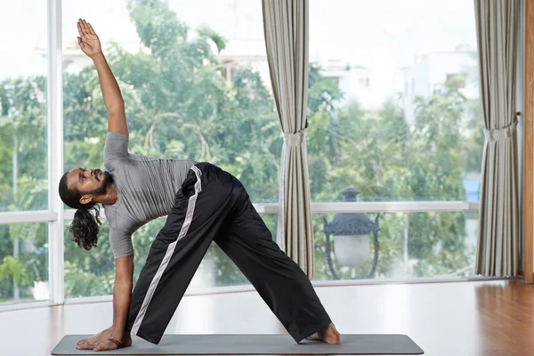 Extended triangle pose — Stock Photo, Image