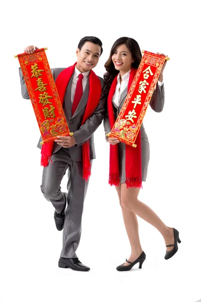 Couple showing New Year scrolls — Stock Photo, Image