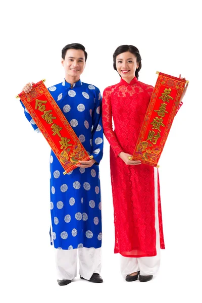 Couple showing New Year scrolls — Stock Photo, Image