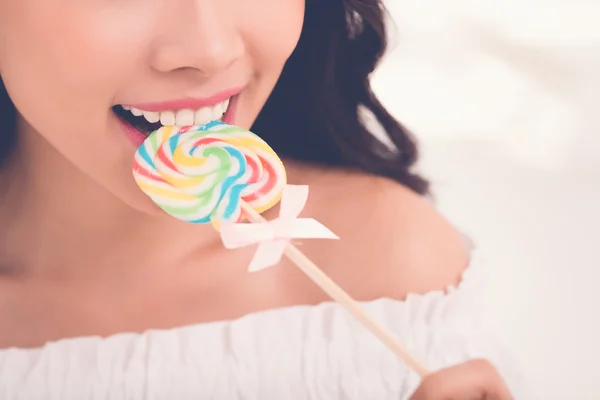 Woman eaiting lollipop — Stock Photo, Image