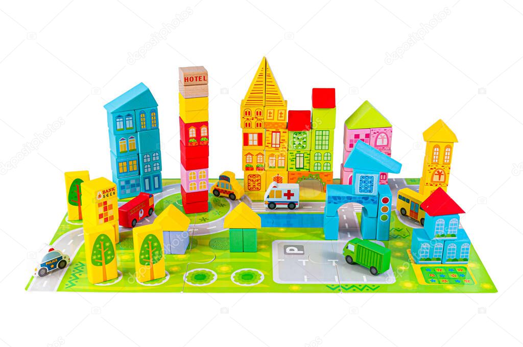 Constructor puzzle city. Build cars and houses. The material is wood. Educational toy Montessori. White background. Close-up.