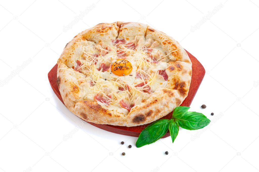 Pizza carbonara with bacon. On a wooden board. Decorated with basil and spices. View from above. White background.