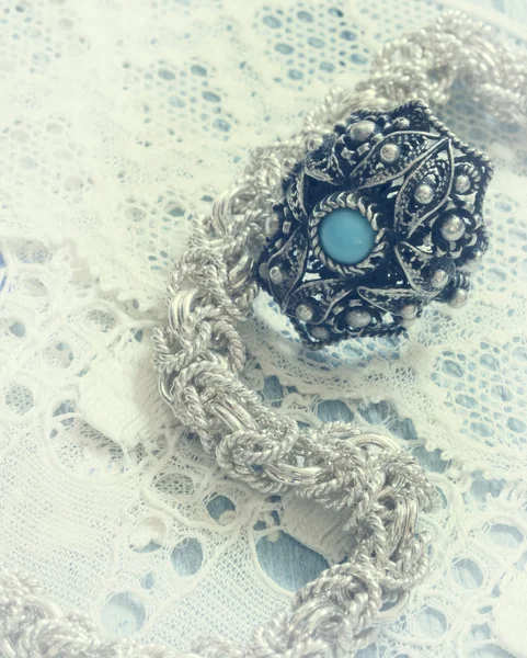 Vintage jewelry on the lace — Stock Photo, Image