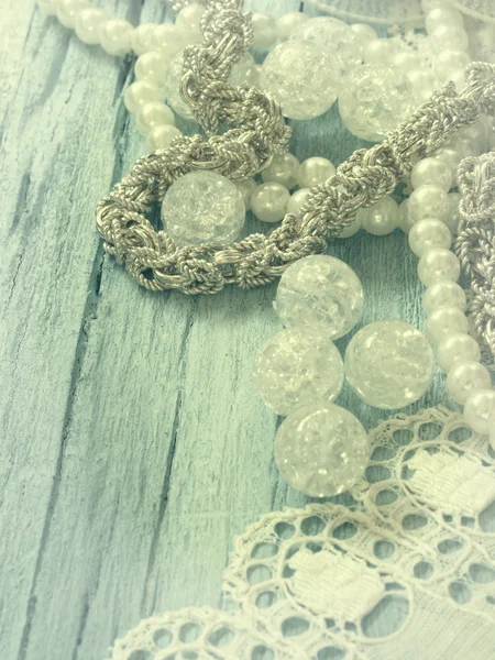 Vintage jewelry on the lace — Stock Photo, Image