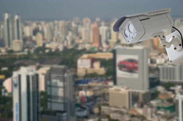 cctv camera with modern building blur background