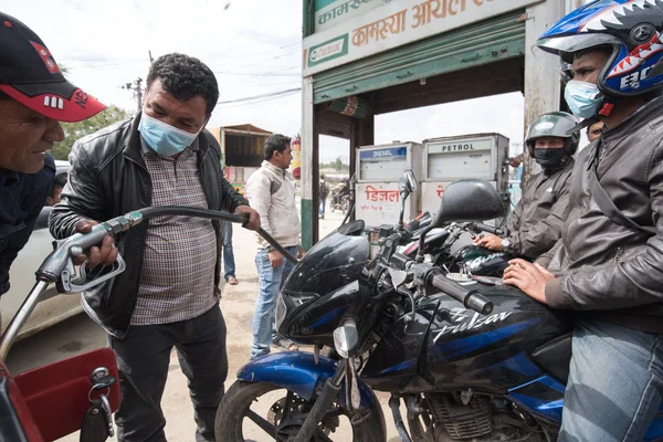 KATHMANDU, NEPAL APRIL 30: Long queue of Motorcycles at the petr