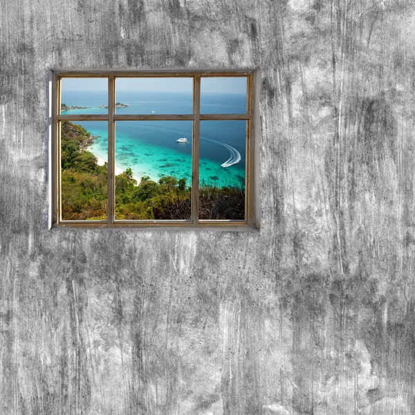 windows frame on cement wall and view of tropical sea