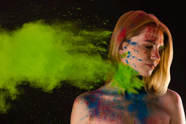 Attractive blond girl in colors Holi — Stock Photo, Image