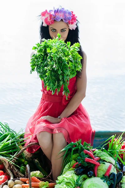 Woman sitting on the boat with parsley — Stock Photo, Image
