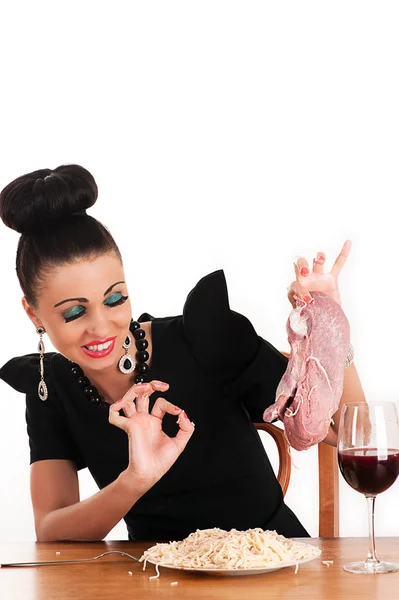 Luxury woman with disgust holding a piece of raw meat — Stock Photo, Image