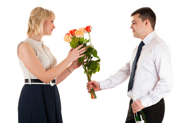 Man giving flowers to woman on March 8