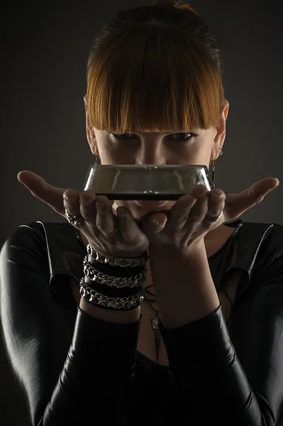 Woman with a bowl in hands — Stock Photo, Image