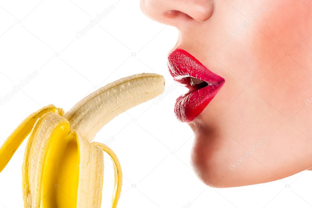 Sexy woman eating banana
