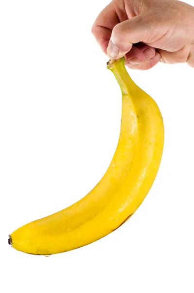 Mão segurando uma banana — Fotografia de Stock