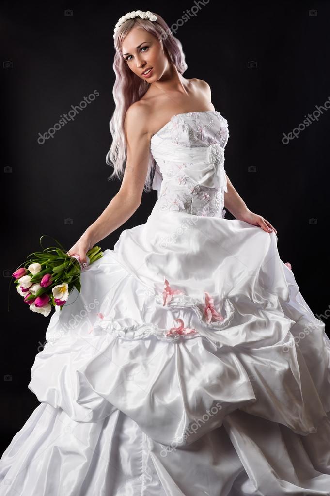 Luxurious Bride In Wedding Dress With A Bouquet Of Tulips Stock