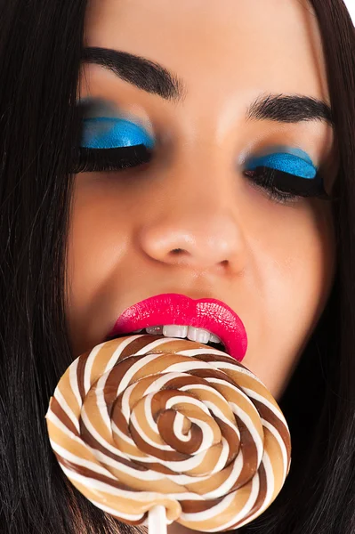 Woman with lollipop. Beautiful bright makeup — Stock Photo, Image