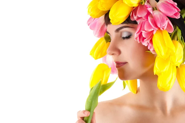 Sensual woman smelling a tulip — Stock Photo, Image