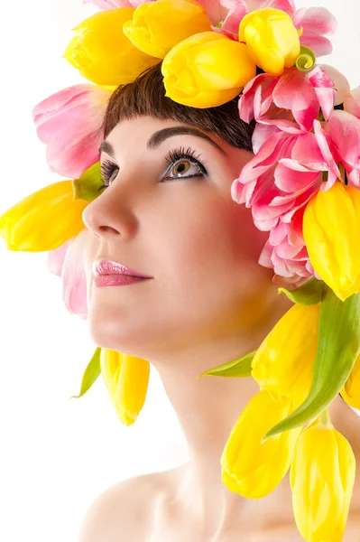 Beautiful woman with tulips on the head — Stock Photo, Image