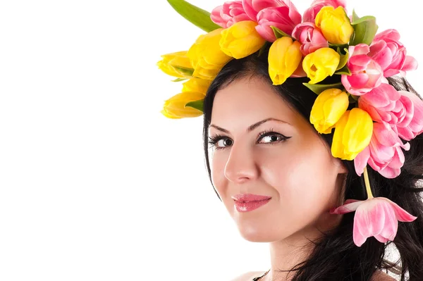 Portrait of a beautiful woman with tulips on the head — Stock Photo, Image