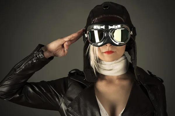 Woman pilot saluting — Stok fotoğraf