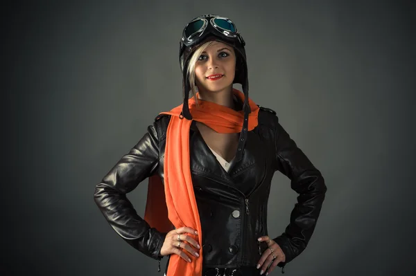 Smiling woman pilot in red scarf in aviator helmet — Stok fotoğraf