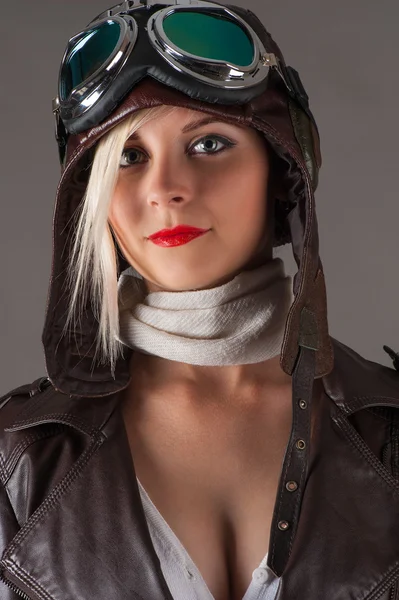 Beautiful woman in aviator helmet — Stok fotoğraf