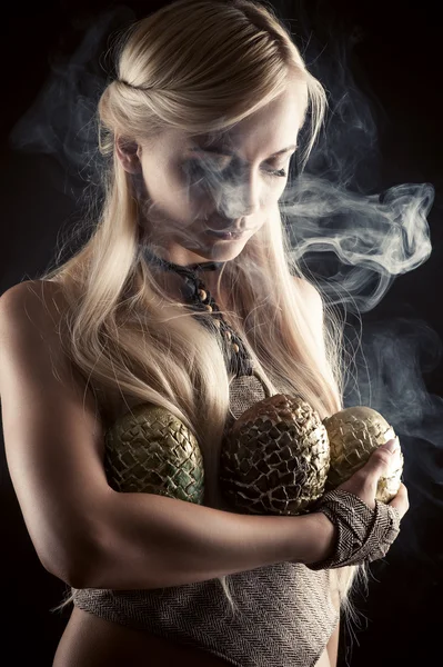 Beautiful blond with three dragon eggs — Stock Photo, Image