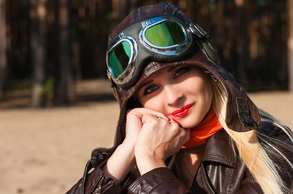 Charming woman in helmet of the pilot — Stock Photo, Image