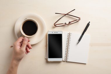 Küçük defter ve kahve fincanı