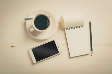 Küçük defter ve kahve fincanı